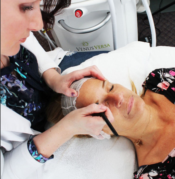 Lana performing a microblading treatment